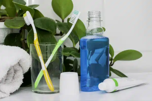 Daily gum care products including mouthwash, toothpaste, and toothbrush