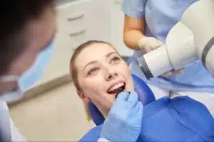 Patient receiving a safe dental X-ray during routine exam